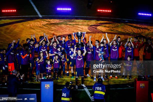 Andres Iniesta from Spain of FC Barcelona celebrating La Liga championship with the trophy in front of the FC Barcelona team during the Andres...