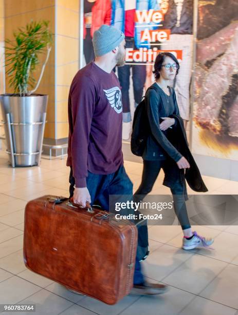 Murder accused Henri van Breda is seen with his girlfriend Danielle Janse van Rensburg during their arrival at the Cape Town International Airport on...