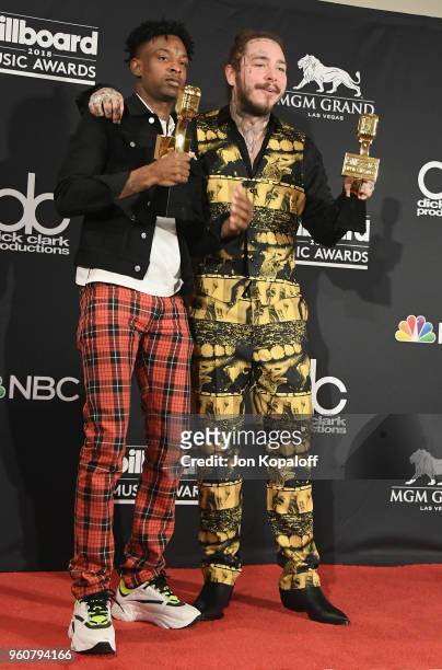 Recording artists 21 Savage and Post Malone, winners of the Top Rap Song award for 'Rockstar,' pose at the 2018 Billboard Music Awards Press Room at...