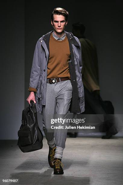 Model walks the catwalk during the Dunhill fashion show during Paris Menswear Fashion Week Autumn/Winter 2010 at Palais De Tokyo on January 23, 2010...