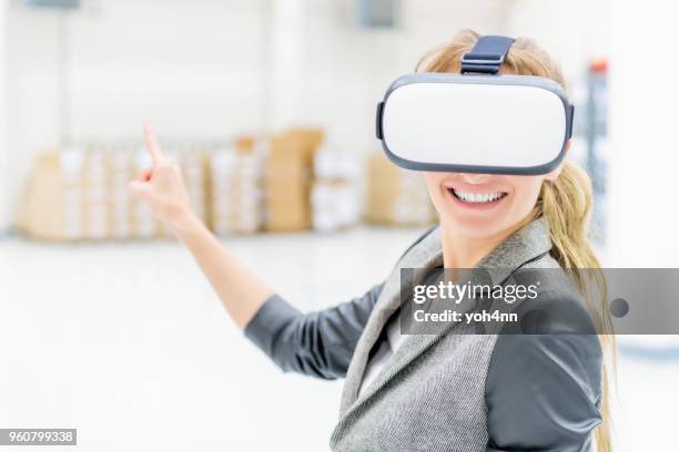 virtual reality goggles & warehouse manager - finger goggles stock pictures, royalty-free photos & images