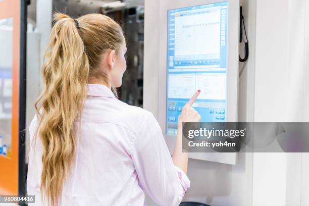 female engineer touch screen & industrial machine - touch screen stock pictures, royalty-free photos & images