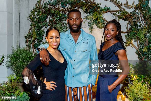 Dawn-Lyen Gardner, Kofi Siriboe and Rutina Wesley attend The Cinema Society with OWN host the 'Queen Sugar' garden cocktail party at Laduree Soho on...