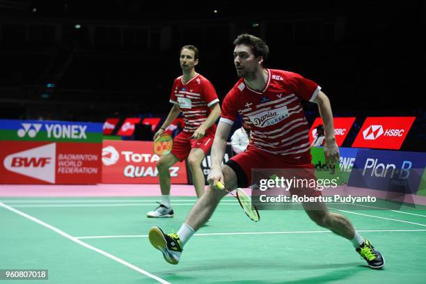 Mathias Boe and Mathias Christiansen of Denmark compete against Koceila Mammeri and Youcef Sabri Medel of Algeria during Preliminary Round on day two...