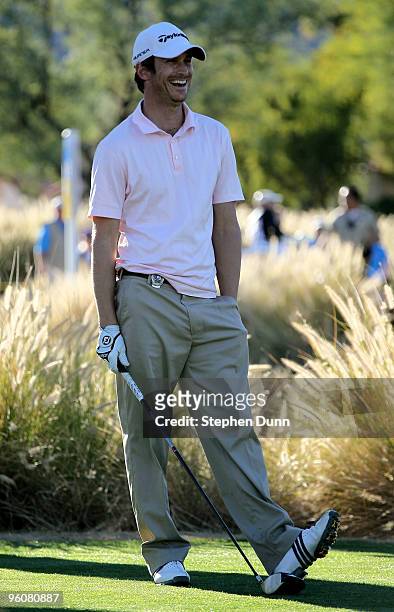Actor Oliver Hudson laughs as he waits to hit his tee shot on the ninth hole on the Nicklaus Private course at PGA West during the third round of the...