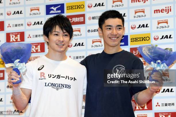 Winner Kohei Uchimura and runner-up Kenzo Shirai pose for photographs after day two of the Artistic Gymnastics NHK Trophy at the Tokyo Metropolitan...