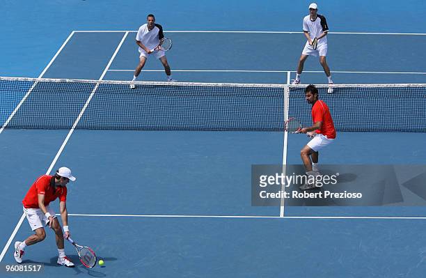 Daniel Nestor of Canada plays a backhand in his third round doubles match with Nenad Zimonjic of Serbia against Philipp Marx of Germany and Igor...