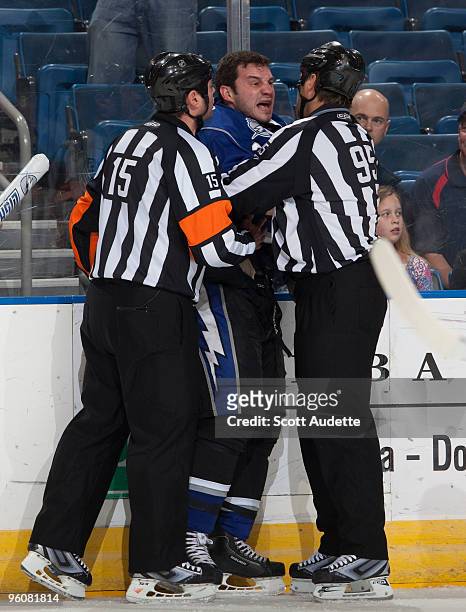 Zenon Konopka of the Tampa Bay Lightning argues with referees Stephane Auger, and Jonny Murray during the first period against the Atlanta Thrashers...