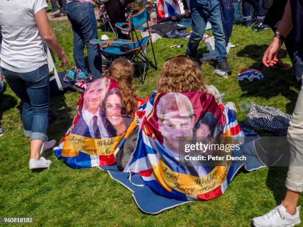 Well-wishers attend the wedding of Prince Harry to Ms. Meghan Markle at Windsor Castle on May 19, 2018 in Windsor, England. Prince Henry Charles...