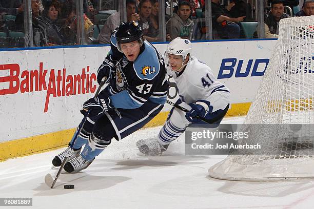 Nikolai Kulemin of the Toronto Maple Leafs chases Dmitry Kulikov of the Florida Panthers on January 23, 2010 at the BankAtlantic Center in Sunrise,...