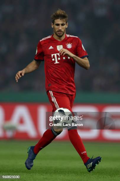 Javi Martinez of Muenchen runs with the ball during the DFB Cup final between Bayern Muenchen and Eintracht Frankfurt at Olympiastadion on May 19,...