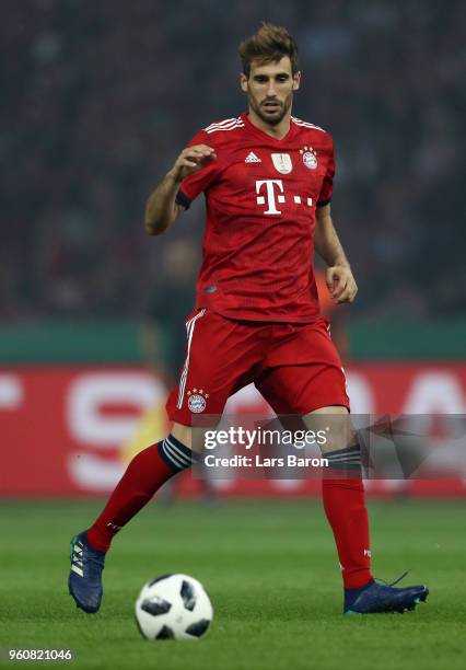 Javi Martinez of Muenchen runs with the ball during the DFB Cup final between Bayern Muenchen and Eintracht Frankfurt at Olympiastadion on May 19,...
