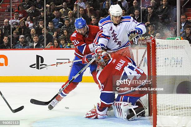 Jaroslav Halak of Montreal Canadiens blocks a shot of Brian Boyle of the New York Rangers during the NHL game on January 23, 2010 at the Bell Centre...