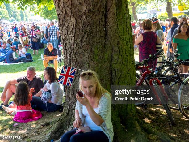 Well-wishers attend the wedding of Prince Harry to Ms. Meghan Markle at Windsor Castle on May 19, 2018 in Windsor, England. Prince Henry Charles...