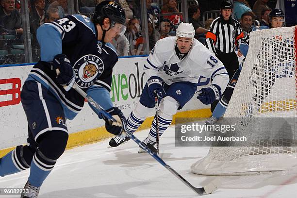 Wayne Primeau of the Toronto Maple Leafs chases Dmitry Kulikov of the Florida Panthers as he skates with the puck on January 23, 2010 at the...
