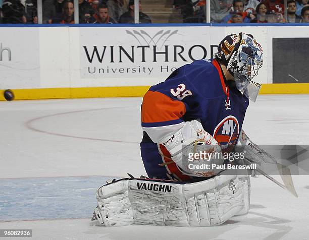 Goalie Rick DiPietro of the New York Islanders misses a shot by Bryce Salvador of the New Jersey Devils for the winning goal in the third period on...