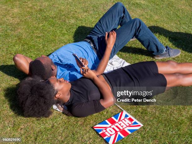 Well-wishers relax after the wedding of Prince Harry to Ms. Meghan Markle at Windsor Castle on May 19, 2018 in Windsor, England. Prince Henry Charles...