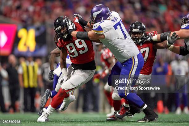 Atlanta Falcons defensive tackle Jon Cunningham battles with Minnesota Vikings offensive tackle Riley Reiff during an NFL football game between the...