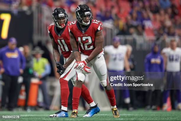 Atlanta Falcons wide receiver Julio Jones and Atlanta Falcons wide receiver Mohamed Sanu look on during an NFL football game between the Minnesota...