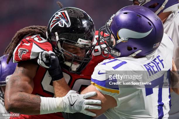Atlanta Falcons defensive tackle Jon Cunningham battles with Minnesota Vikings offensive tackle Riley Reiff during an NFL football game between the...
