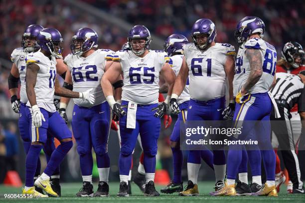 Minnesota Vikings center Pat Elflein , Minnesota Vikings defensive end Ade Aruna and Minnesota Vikings center Nick Easton look on during an NFL...