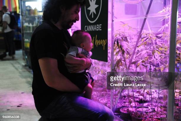 Three months baby child Antonio and his father attend the Indica Sativa Trade at Unipol Arena on May 20, 2018 in Bologna, Italy. The 6th Italian...