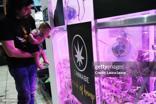 Three months baby child Antonio and his father attend the Indica Sativa Trade at Unipol Arena on May 20, 2018 in Bologna, Italy. The 6th Italian...