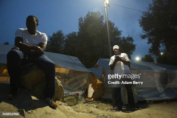Congolese refugees use a Wifi hotspot at the Moria refugee camp on May 20, 2018 in Mytilene, Greece. Despite being built to hold only 2,500 people,...