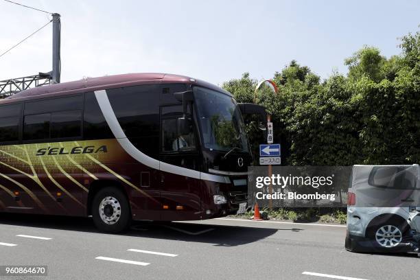 Hino Motors Ltd. Tour bus stops autonomously in front of an obstacle during a demonstration at a test course in Hamura, Tokyo Metropolis, Japan, on...