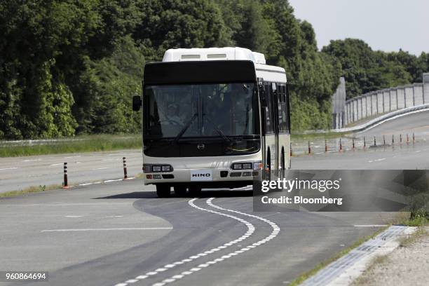 Hino Motors Ltd. Autonomous bus travels along dotted lines during a demonstration at a test course in Hamura, Tokyo Metropolis, Japan, on Monday, May...