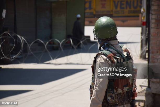 Indian Forces Stands alert during restrictions in Srinagar summer capital of Indian Administered Kashmir on Monday to prevent the March call of JRL ....