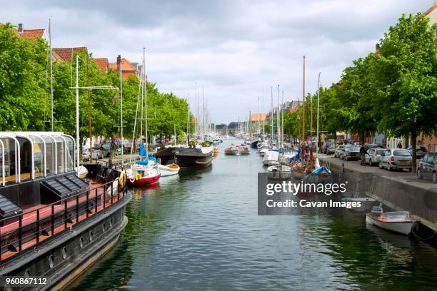 sailboats moored at harbor - christianshavn stock pictures, royalty-free photos & images