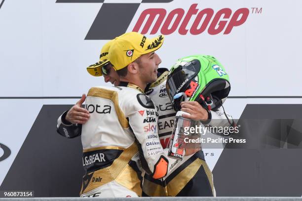 Moto 3 riders Andrea Migno and Albert Arenas on podium during Le Mans race day.