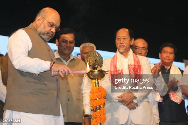 National President Amit Shah lighting the inauguration lamp of the third conclave of the North East Democratic Alliance at Guwahati, Assam.