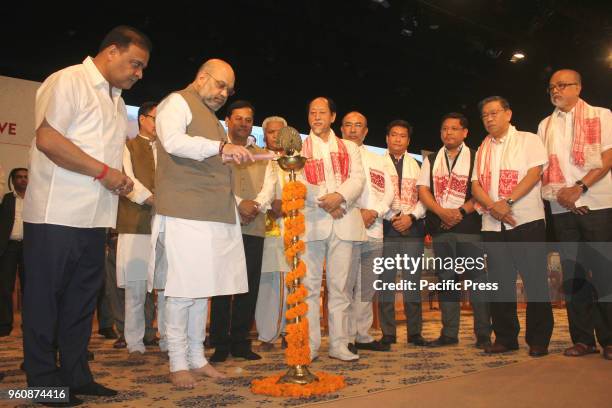 National President Amit Shah lighting the inauguration lamp of the third conclave of the North East Democratic Alliance at Guwahati, Assam.