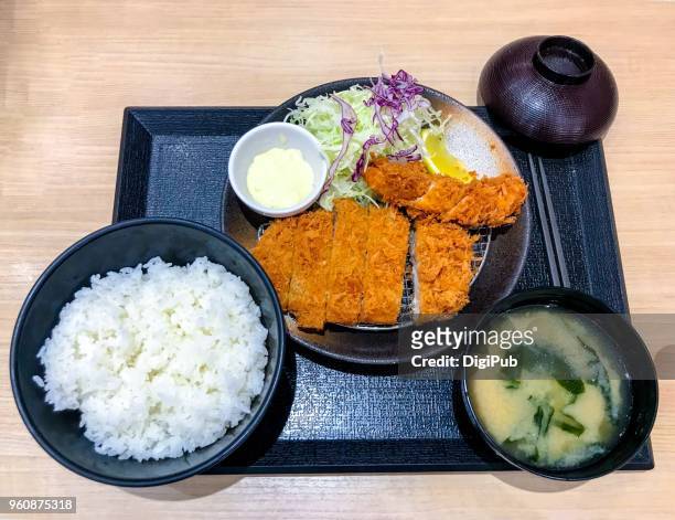pork and chicken cutlets meal served in tray on table - tonkatsu stock pictures, royalty-free photos & images