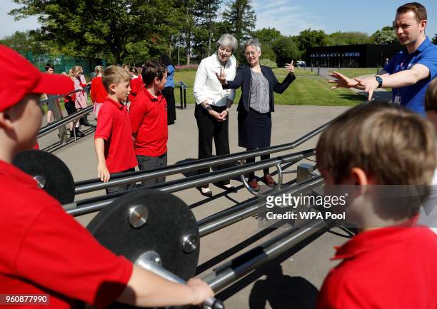 Britain's Prime Minister, Theresa May, visits a local school before delivering a speech on science and the Industrial Strategy on May 21, 2018 in...