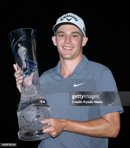 Aaron Wise of the United States holds the winner's trophy after his victory in the AT&amp;T Byron Nelson golf tournament at the Trinity Forest Golf...