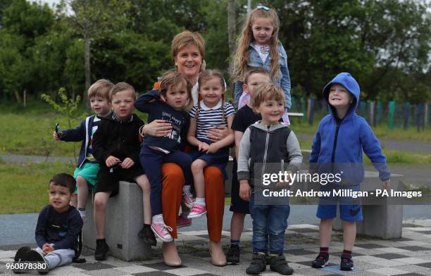 First Minister Nicola Sturgeon with children from Bridgeton family centre as she visits the Cuningar Loop in Glasgow where she revealed new...