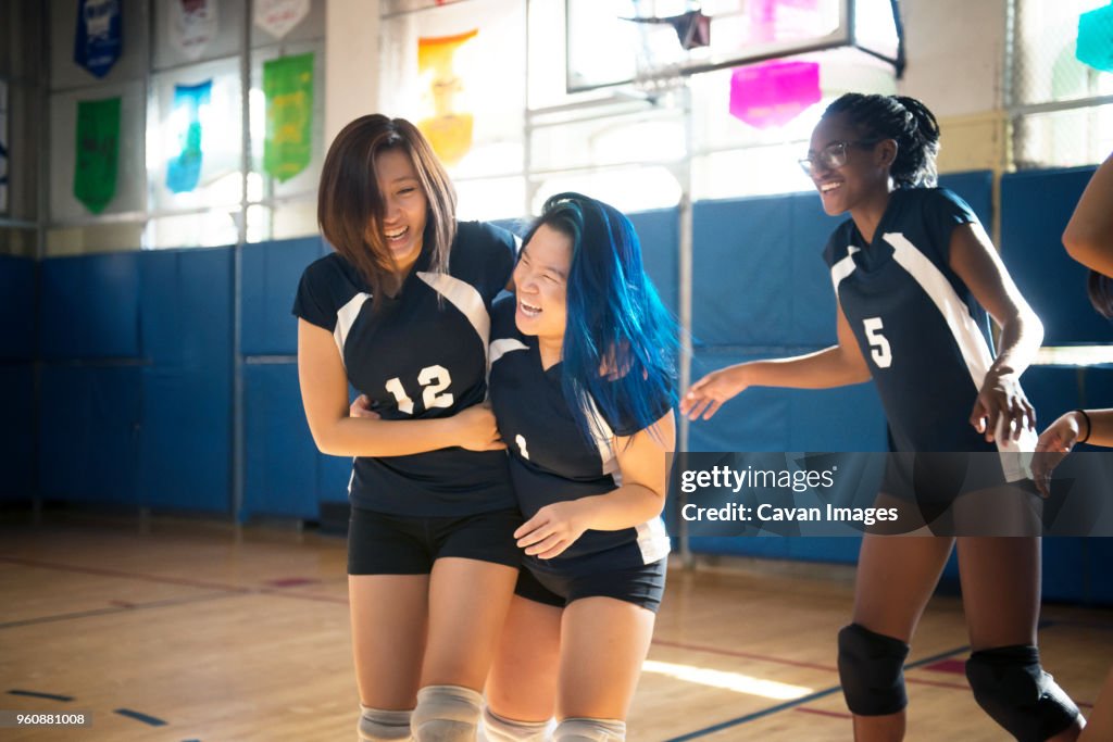Teenage girls enjoying at volleyball court