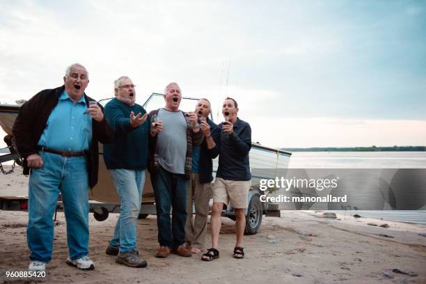 five active seniors brothers on a fishing trip - five people stock pictures, royalty-free photos & images