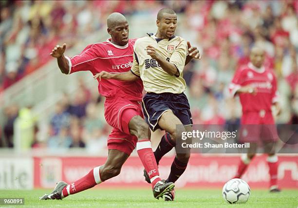 Ashley Cole of Arsenal is fouled by Ugo Ehiogu of Middlesbrough during the FA Barclaycard Premiership match played at the Riverside Stadium in...