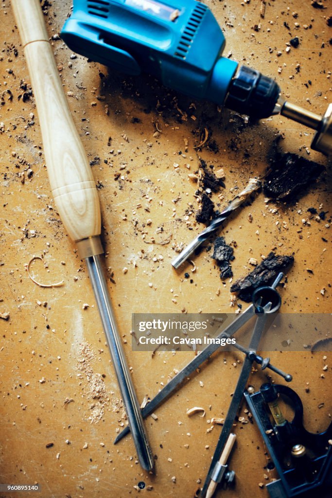 Overhead view of work tools on table at workshop