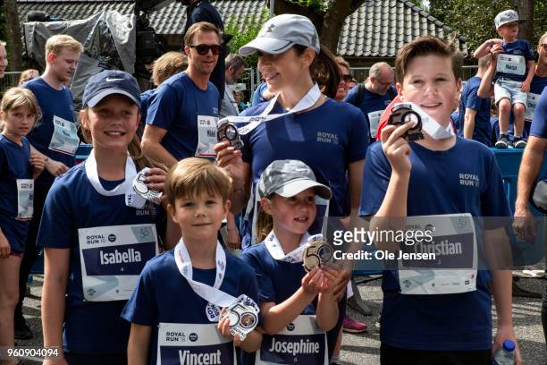 Crown Princess Mary of Denmark and her children Princess Isabella, Prince Vincent, Prince Christian and Princess Josephine - proudly show their...