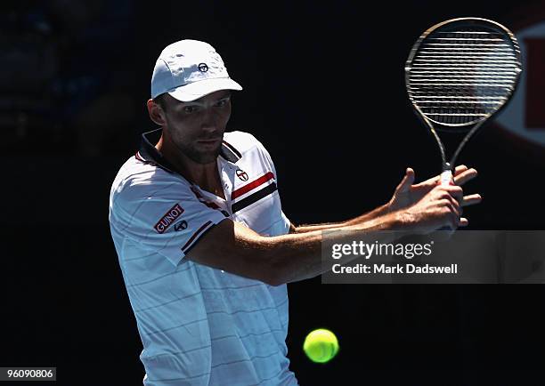 Ivo Karlovic of Croatia plays a backhand in his fourth round match against Rafael Nadal of Spain during day seven of the 2010 Australian Open at...