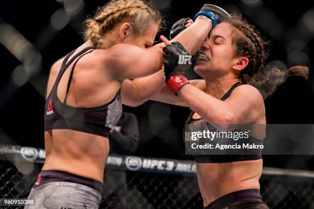 Andrea Lee of USA hits Veronica Macedo of Venezuela in the women's flyweight fight during the UFC Fight Night event at the Movistar Arena, on May 19,...