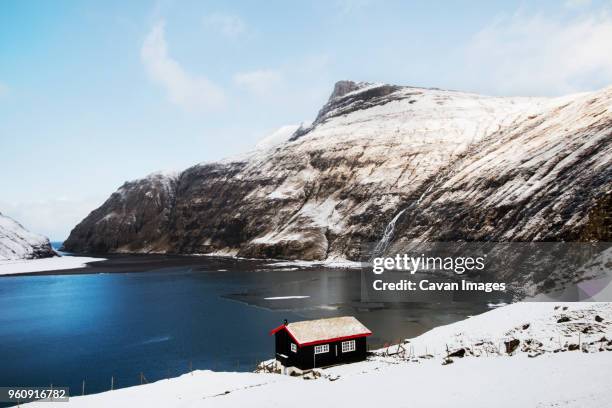 scenic view of snow covered mountain at faroe islands - faroe islands stock pictures, royalty-free photos & images