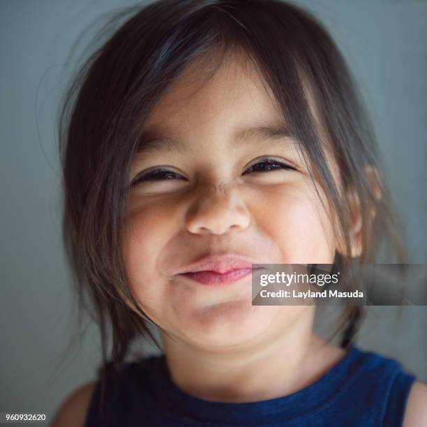 wrinkled nose toddler face - cute girl toddler stock-fotos und bilder