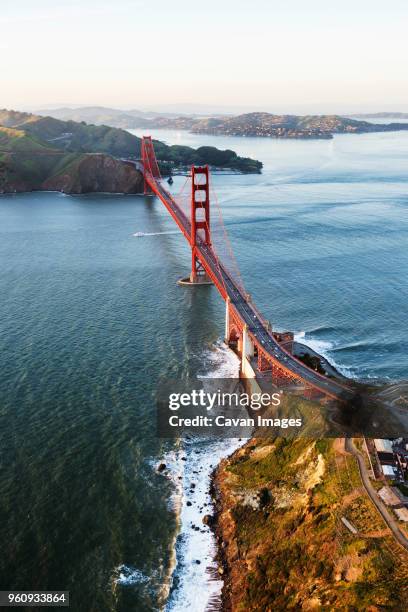 aerial view of golden gate bridge over san francisco bay - bahía de san francisco fotografías e imágenes de stock