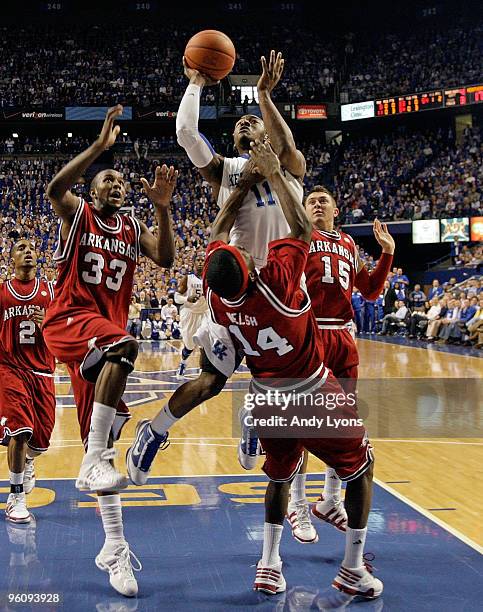John Wall of the Kentucky Wildcats shoots the ball over Stefan Welsh of the Arkansas Razorbacks during the SEC game on January 23, 2010 at Rupp Arena...